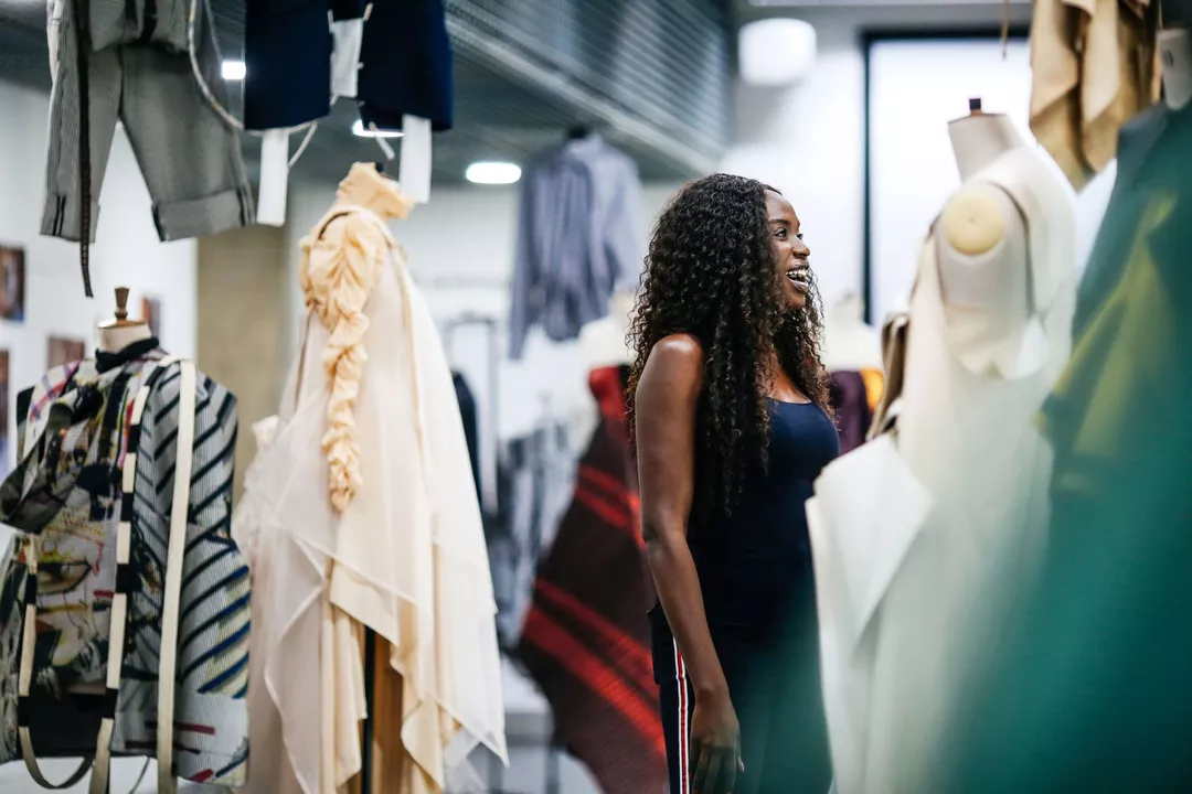 International student designing garments in Ravensbourne fashion lab