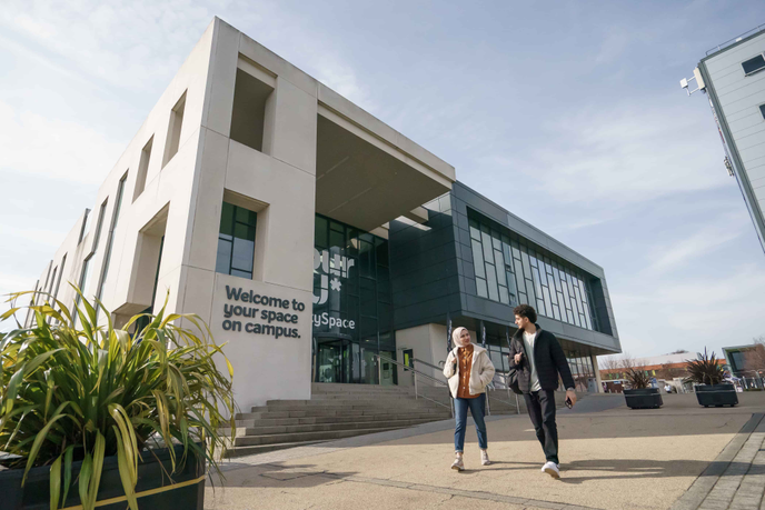University of Sunderland main campus building with students walking